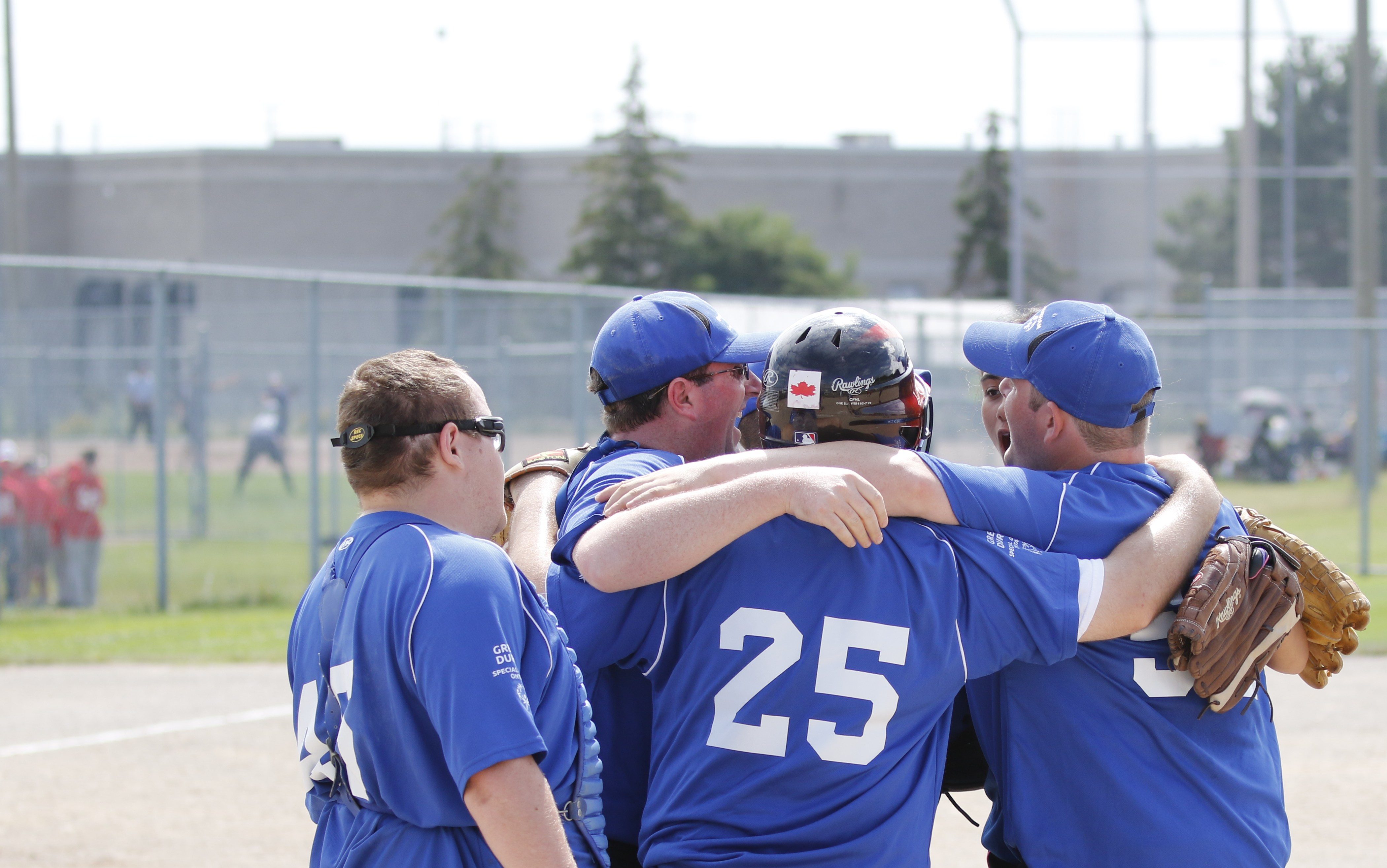 Softball team celebrates.